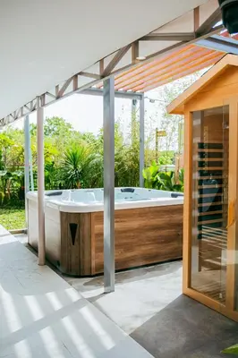 a hot tub on the patio of a house at Love, Lourdes Villa in Imus