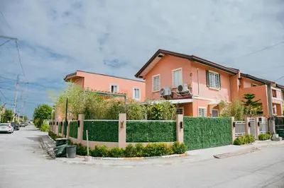 a house with a fence in front of a street at Love, Lourdes Villa in Imus