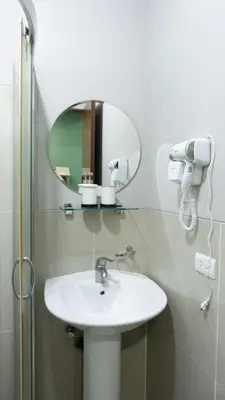 a bathroom with a sink and a mirror at The Beacon Condo T2-Studio in Manila