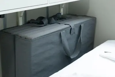 a bed frame in the corner of a room at The Beacon Condo T2-Studio in Manila