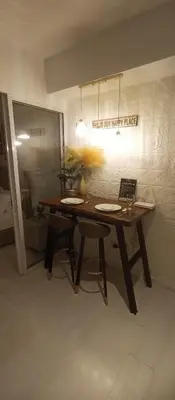 a table in a room with a sign that reads thats our happy place at Casa Crisav Staycation place at AZURE in Manila