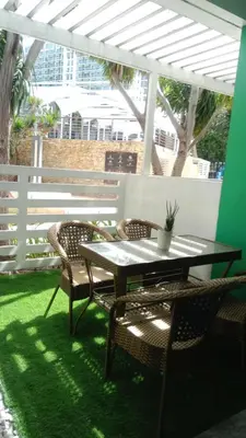 a patio with a table and two chairs and a table and chairs at Casa Crisav Staycation place at AZURE in Manila