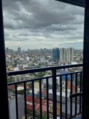 a view of a city from a balcony at Urban Space 1BR with Balcony in Manila
