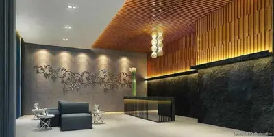 a lobby with two chairs and a fireplace at Gorgeous 1BR Condo Unit near MOA and Manila Int'l Airport in Manila