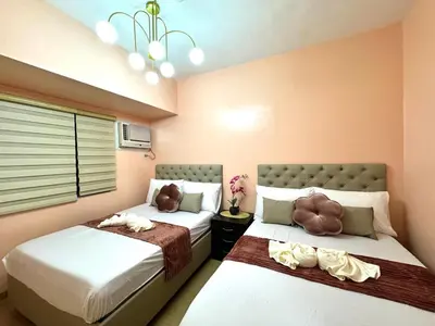 a bedroom with two beds with stuffed animals on them at Grand Riviera Suites 1202 front of US Embassy by Prime Stay in Manila