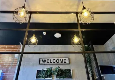 a welcome sign in the window of a store at LIXURY SUITES in S Residence Condo Pasay City in Manila