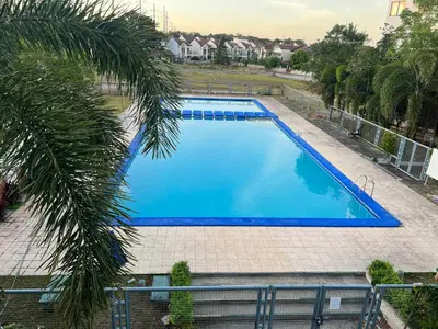 an overhead view of a large blue swimming pool at Las Asturias in Balibago
