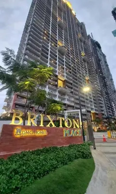 a large building with a sign in front of it at pasig city resort condo in Manila