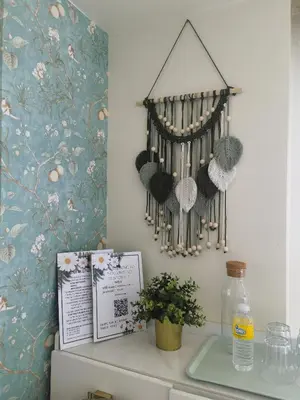 a shelf with a bunch of knitted hats on a wall at pasig city resort condo in Manila