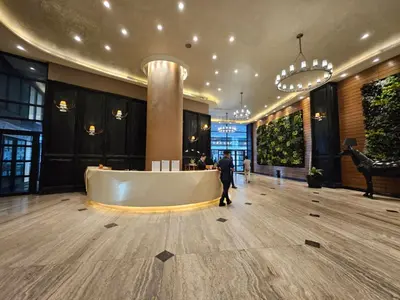 a man is standing in the lobby of a building at Room with stunning view in Makati in Manila