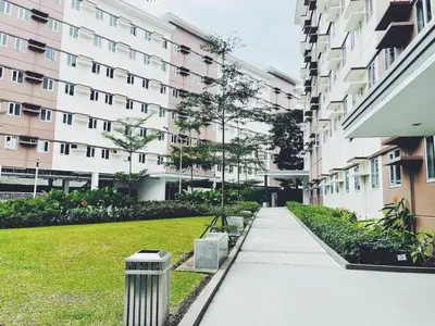 an empty sidewalk in front of a building at The Stars Lil' Suite in Trece Martires