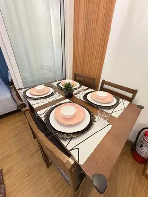 a table with three plates on top of it at Bahay-Bahayan in Manila