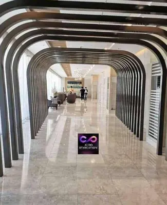 a lobby with a sign in the middle of a building at Aldo shore 3 tower 2 mall of Asia in Manila