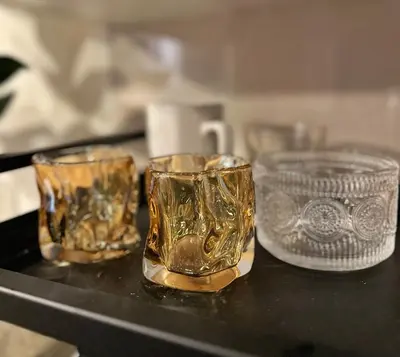a group of glasses sitting on a table at Studio in Greenbelt with Wifi, Pool and Gym in Manila