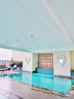 a large swimming pool in a building at Vincondotel Malate Manila 2BR Admiral 2823 in Manila