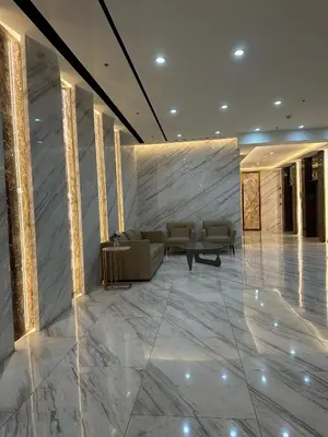a lobby with a couch and chairs in a building at Grand View Tower in Manila