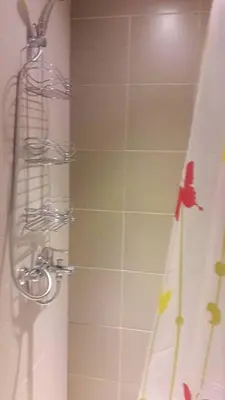 a shower in a bathroom with a shower curtain at Araneta Cubao No Brown Outs 1BR Furnished Condo with Balcony free WiFi Netflix in Manila