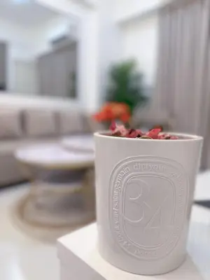 a cup filled with candy canes sitting on a table at Le Luxe 102 by Ara li in Manila