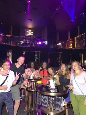 a group of people standing in a bar at All Access Manila Tour in Manila