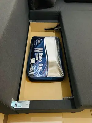 a box with a bottle of energy drink in it at 1BR luxury bed, movie room, swimming pool access in Manila