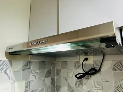 a stainless steel stove top oven in a kitchen at 1BR luxury bed, movie room, swimming pool access in Manila