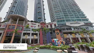 a hotel with two tall buildings in the background at Affordable Fully Furnished Place in the City in Manila