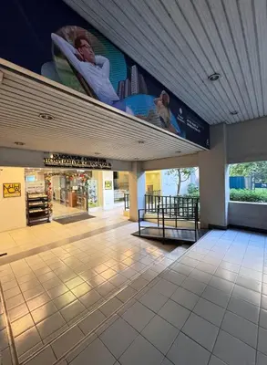 a building with a large sign on the top of it at Urban Escape for You & Your Pet in Manila