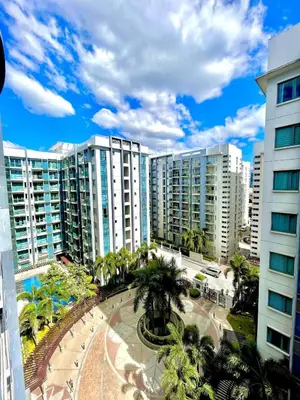 a view of a city with palm trees and buildings at NAIA T3 Two Palmtree Villas 3-5mins away from Resorts World Casino Manila in Manila
