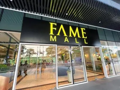 a store front with a sign that reads fame mall at fame residence staycation in Manila
