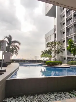 a swimming pool in the middle of a building at VSV Luxury Family Suite staycation Moa in Manila