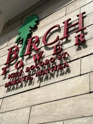 a red sign on the side of a building at Kiean Leases in Manila
