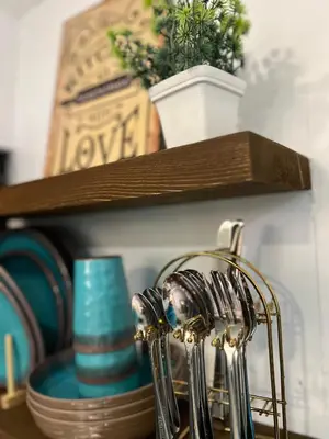 a shelf with a bunch of forks on a table at Cozy Studio near MOA, Airport & Star City, Pasay in Manila