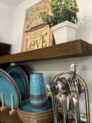 a shelf with blue dishes and a blue holder at Cozy Studio near MOA, Airport & Star City, Pasay in Manila