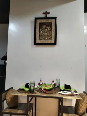a dining room table with plates of food on it at Chic Haven in Manila