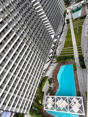 an overhead view of two tall buildings with a swimming pool at Casa Vigonia in Manila