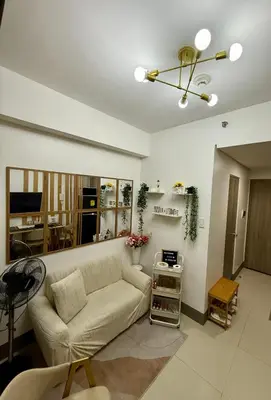 a living room with a couch and a table at Casa Vigonia in Manila