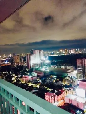 a view of a city skyline at night at Casa Arville in Manila