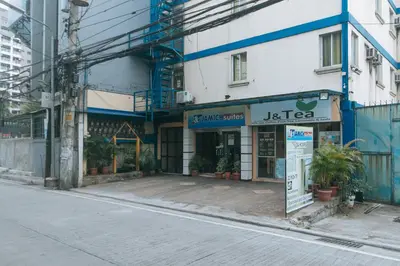 an empty street in front of a building at J and T Jamich Suites by RedDoorz in Manila