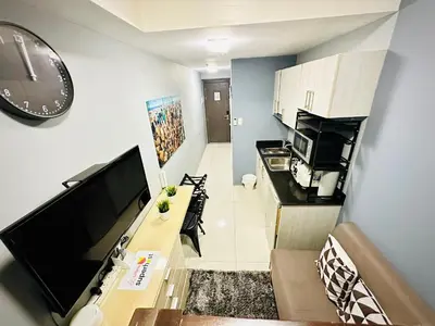 a small apartment with a kitchen and a living room at STYLISH LUXE APARTMENT in SMDC GREEN RESIDENCES in Manila