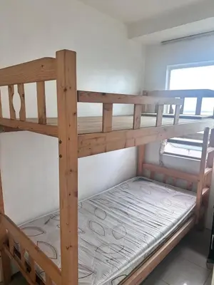a bunk bed in a small room with a bunk bedutenewayangering at Tranquil Harbor in Manila