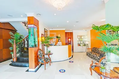 a lobby of a hotel with palm trees at VIP Hostel, Near PNR Pasay Evangelista, Makati Manila in Manila