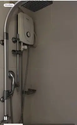 a shower in a bathroom with a shower head at Jazz Residences Tower B Makati in Manila