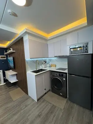 a kitchen with a sink and a dishwasher at 2BR Apartment in Pasig City in Manila