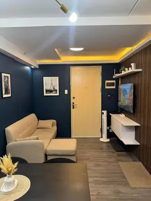 a living room with a couch and a table at 2BR Apartment in Pasig City in Manila