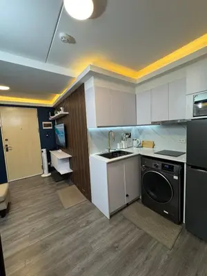 a kitchen with a sink and a dishwasher at 2BR Apartment in Pasig City in Manila