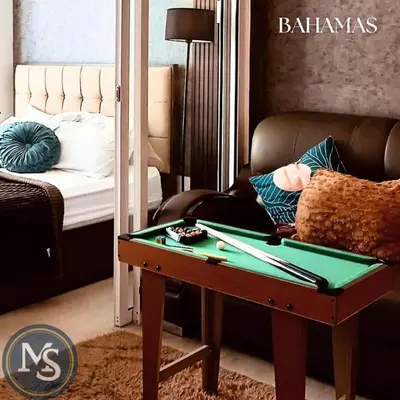 a living room with a table with a billiard sidx sidx sidx at Azure Residences Bahamas good for 3 pax in Manila