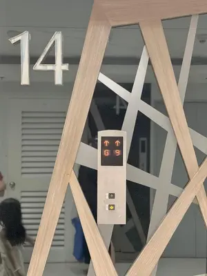 a reflection of a remote control in a window at Sea Residences 2BR Pool View Unit for 4-8 pax - Beehive Stay MOA in Manila