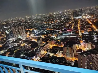 a view of a city at night at Modern-Studio with Balcony Stunning View in Manila