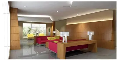 a living room with a red couch and yellow chairs at Laidback Cavern at Studio City Alabang in Manila