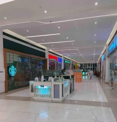 a shopping mall with a counter in the middle at Family Suites- Self Service Condo Unit in Jazz Residences Makati in Manila